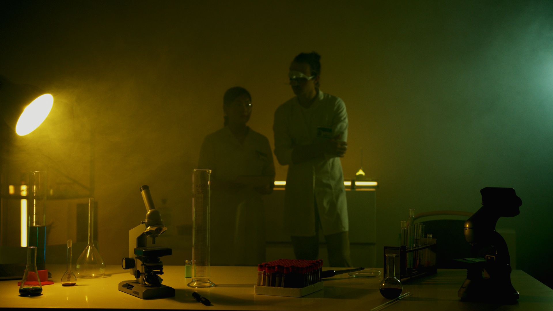 Researchers working in a dim laboratory — semaglutide vs tirzepatide research